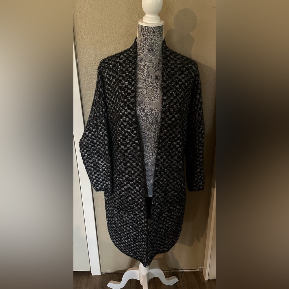 Cozy warm sweater jacket with pockets. Black yarn has a bit of sparkle to it.